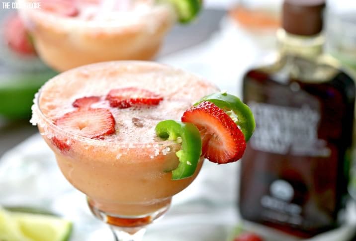 Skinny Strawberry Jalapeno Margaritas made healthier with fruit juices and agave nectar! These are easy and SO ADDICTING! Cheers on Cinco De Mayo!