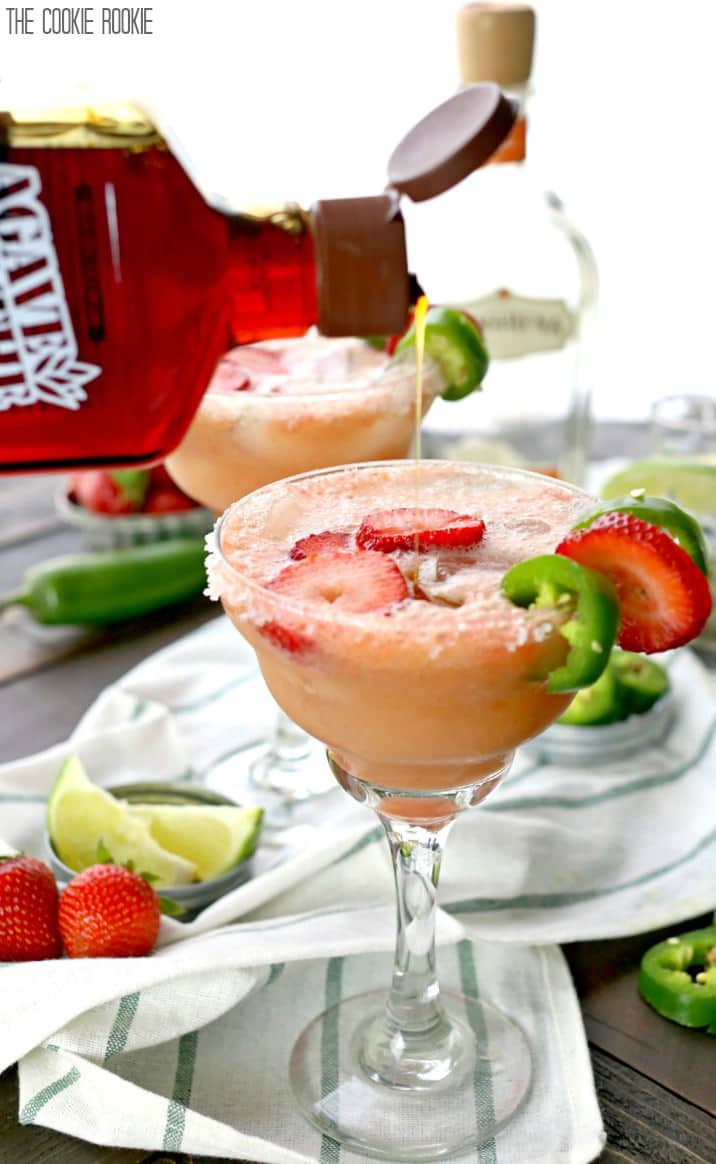 Skinny Strawberry Jalapeno Margaritas made healthier with fruit juices and agave nectar! These are easy and SO ADDICTING! Cheers on Cinco De Mayo!