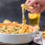 Spicy Chicken Enchilada Dip, the BEST DIP EVER! Full of beans, corn, chicken, cheese, enchilada sauce, and cream cheese! SO ADDICTING! Best tailgating dip for any party!