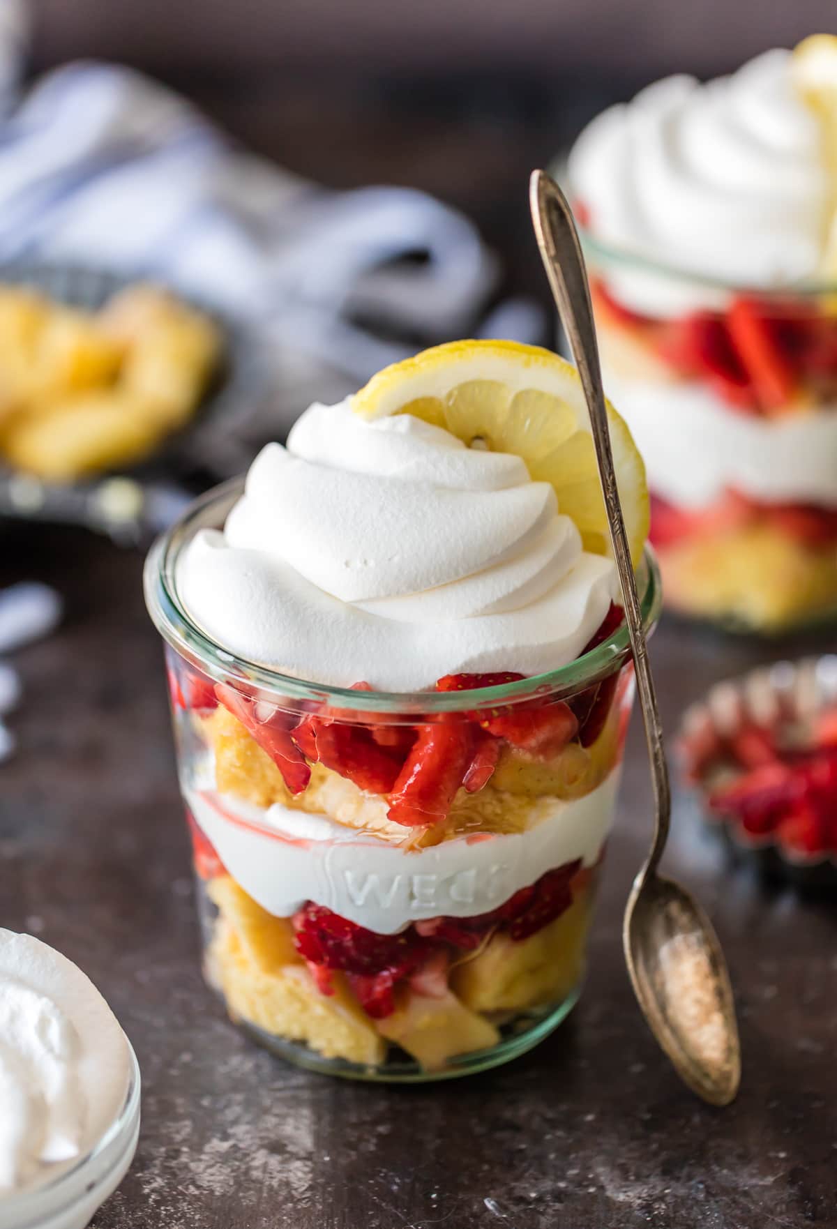 These LAYERED LEMON STRAWBERRY SHORTCAKE CUPS are super simple and delicious! Layers of lemon cake, strawberries, and cool whip make the best sweet treat for after school or anytime!