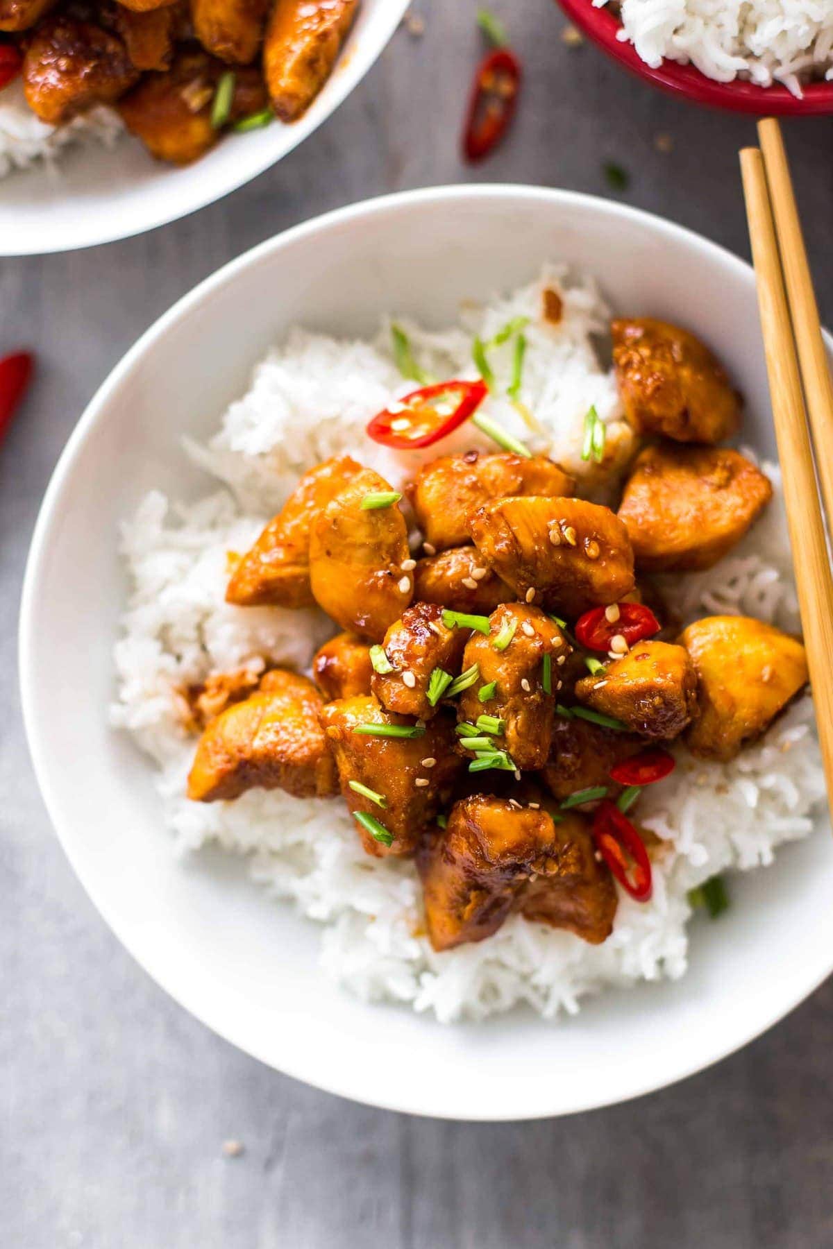 bourbon chicken and white rice in a white bowl