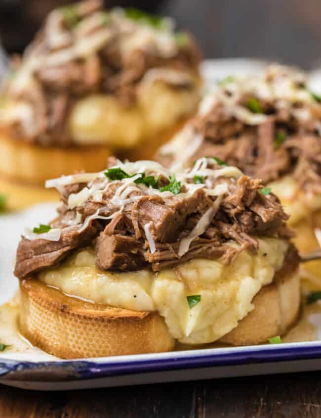 open faced roast beef sandwiches on a plate