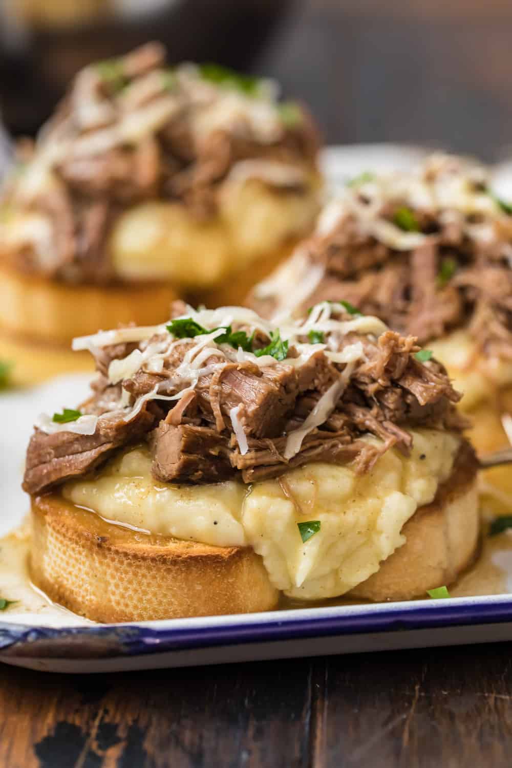 Open Faced Roast Beef Sandwich on a blue and white plate.