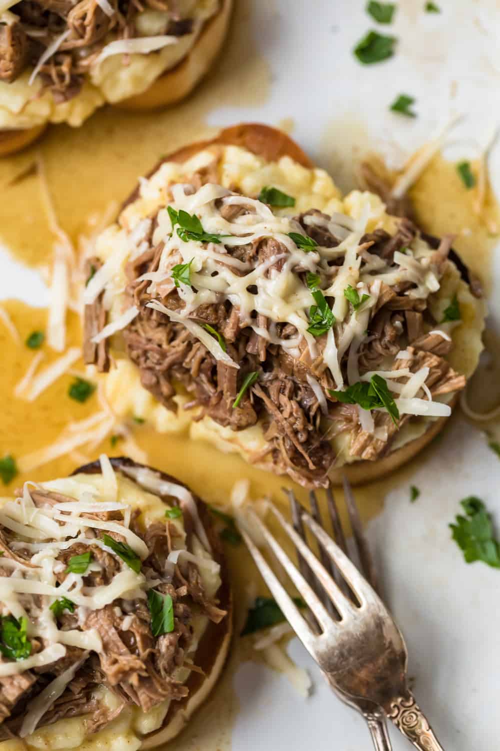 Shredded cheese on top of the Open-Faced Roast Beef Sandwich.