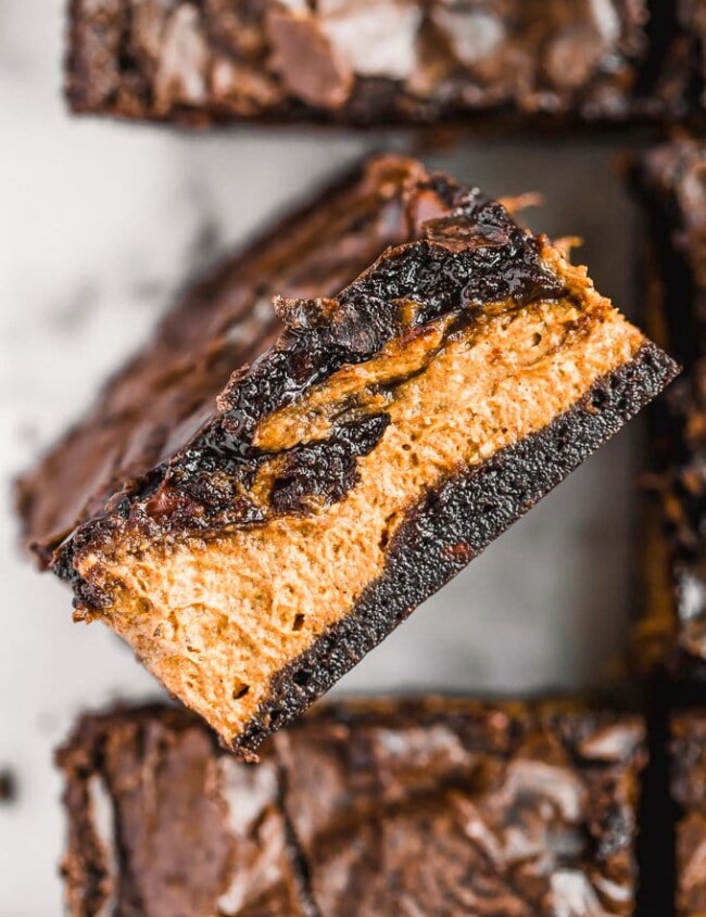 Pumpkin Brownies are an easy fall dessert recipe perfect for Halloween or Thanksgiving. Add a layer of pumpkin to your brownies for something fun and delicious!