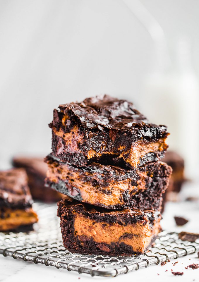 Chocolate brownies with a layer of pumpkin filling in the middle