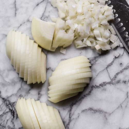 Wondering how to cut an onion? So many recipes call for a bit of onion, and I very much approve of that! Whether you need diced onion, minced onion, or chopped onion, you need to know how to do it properly. Learning how to chop an onion is one of those basic cooking skills that will always come in handy. I'll show you how to dice an onion, how to mince onion (plus the difference between the two), how to store cut onions, and even how to saute onions!