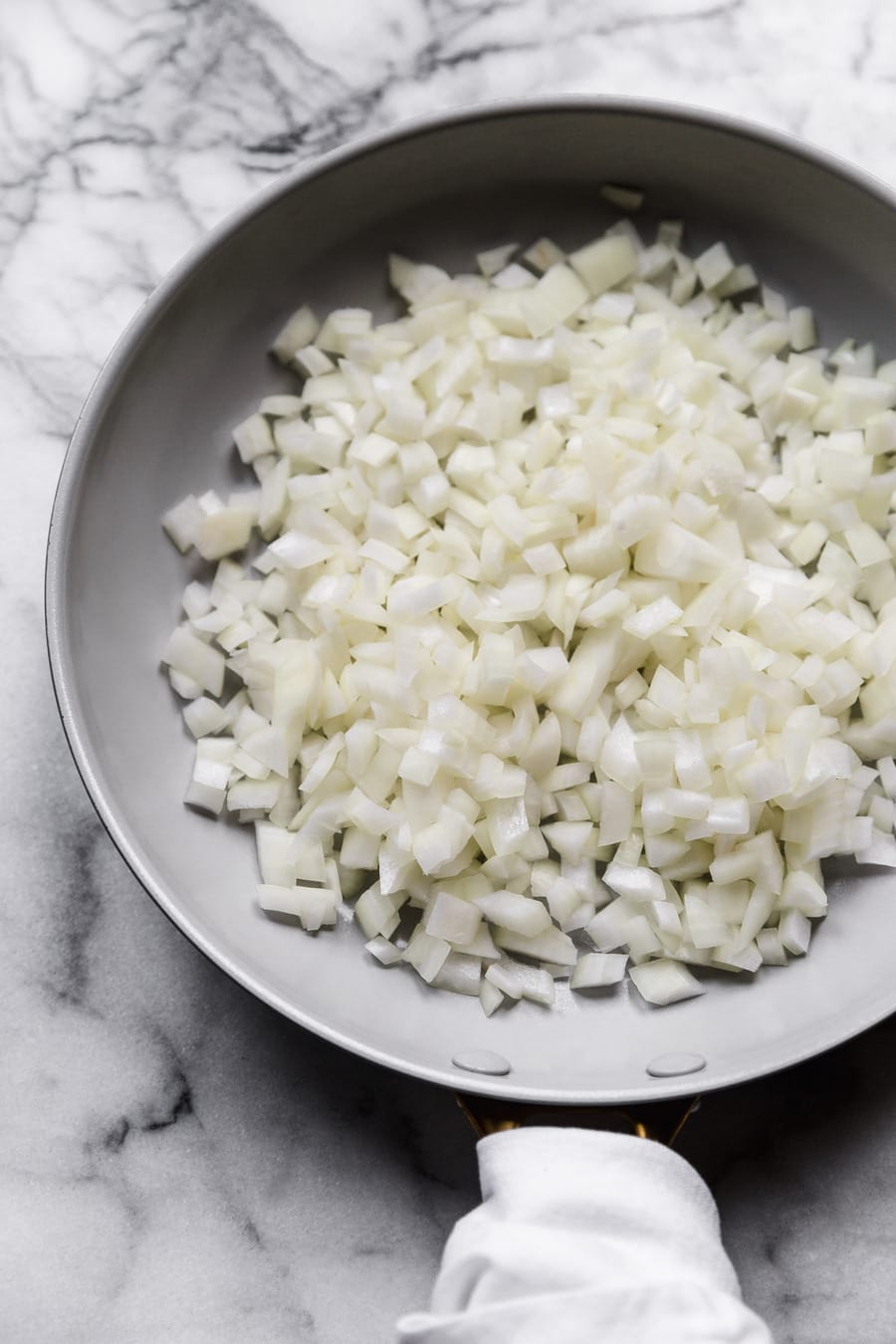 diced onion in a skillet