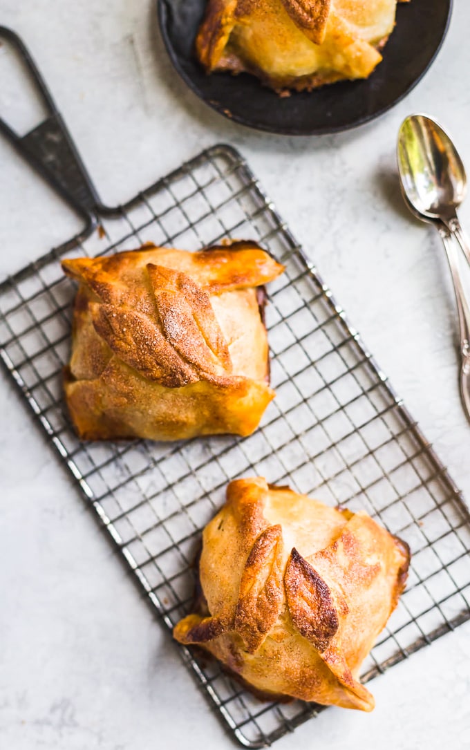 Two apple dumplings on a cooling rack