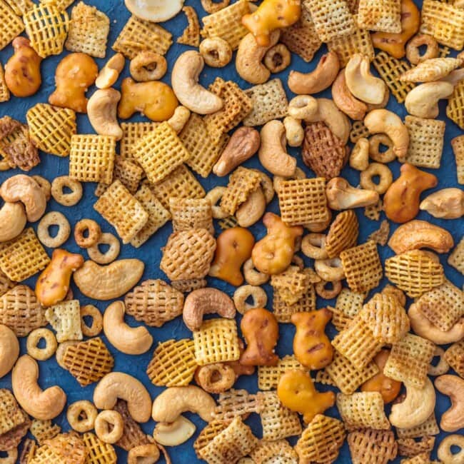 Chex Party Mix is a recipe my Mom has been making since I was a little kid. It's our family's favorite Chex Mix Recipe! It doesn't get better than this mix of cereal, nuts, pretzels, and all that spice! A little bit sweet and little bit spicy. This BEST EVER Chex Party Mix Recipe is perfect for Christmas, tailgating, Summer BBQs, and every day in between. SO ADDICTING!