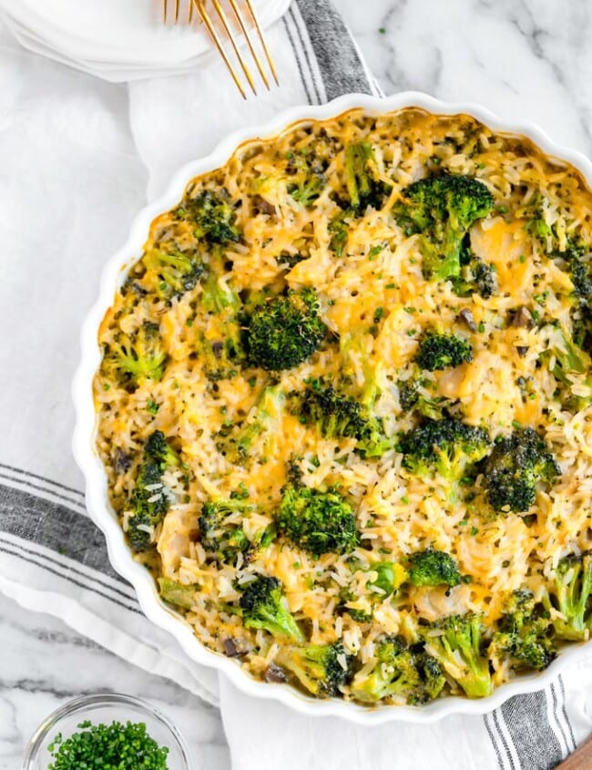 Broccoli Cheese Rice Casserole is a creamy, cheesy side dish perfect for any meal. This baked green rice casserole is a classic recipe for Thanksgiving, filled with broccoli, rice, cheese, cream of mushroom, & water chestnuts.