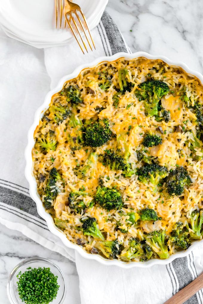 Broccoli Cheese Rice Casserole in a white casserole dish