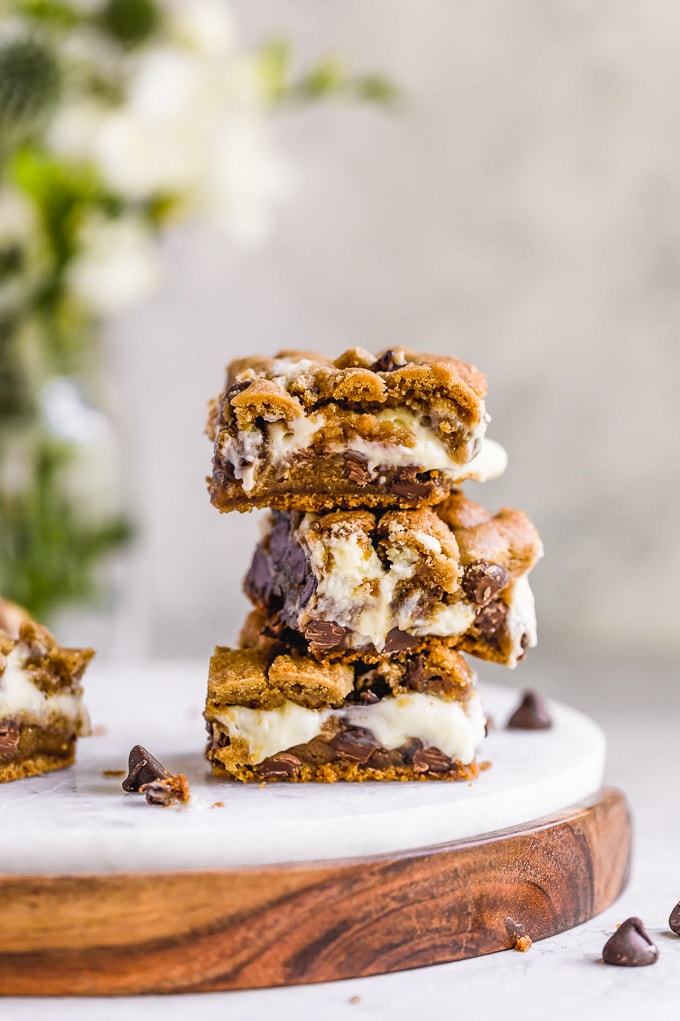 A stack of peanut butter chocolate chip cheesecake bars