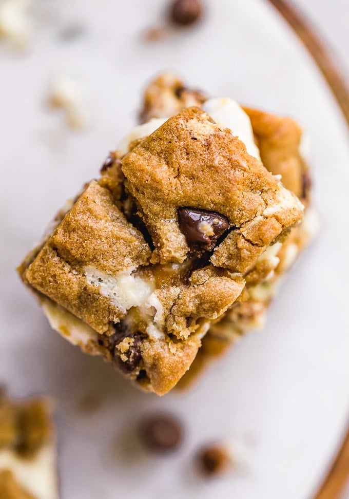 A stack of chocolate chip cheesecake bars viewed from the above