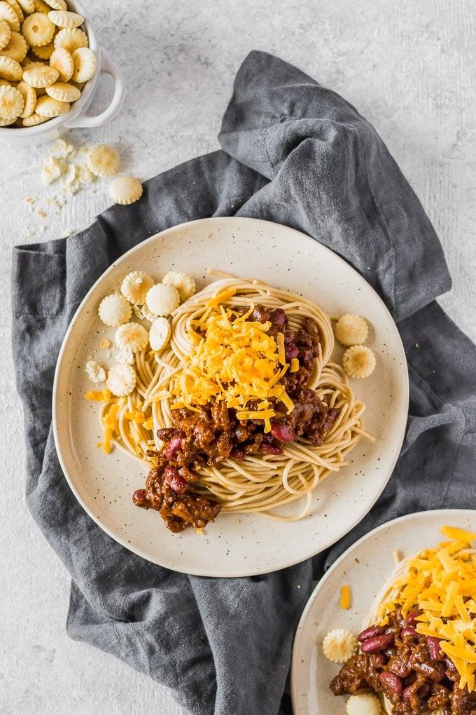 two plates of Cincinnati Chili on blue towel