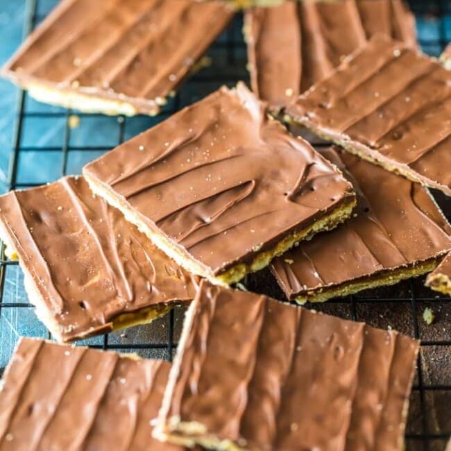 Saltine Cracker Toffee is a simple and tasty snack to prepare for unexpected visitors or just for a night in. Chocolate Saltine Toffee is an easy go-to recipe when you just don't have much on hand. And they're actually SO good, and so satisfying. This Saltine Cracker Toffee with Chocolate recipe is the perfect thing to keep on hand for when you have a sudden chocolate craving.
