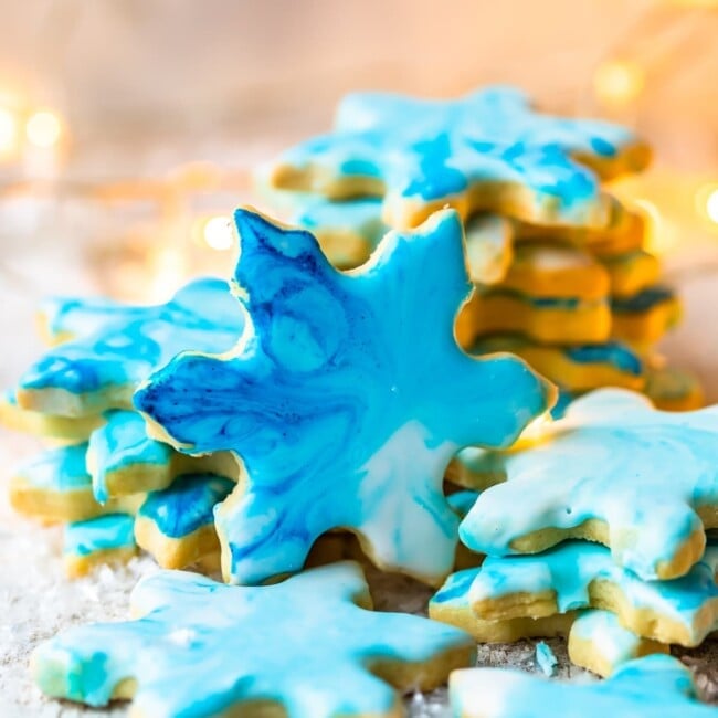 Christmas Butter Cookies with Powdered Sugar Icing are a MUST for the holidays. Simple iced cookies are one of the best treats for Christmas, and this easy butter cookies recipe is my FAVORITE. Make your favorite shapes with cookie cutters, and decorate however you like using our powdered sugar icing recipe!
