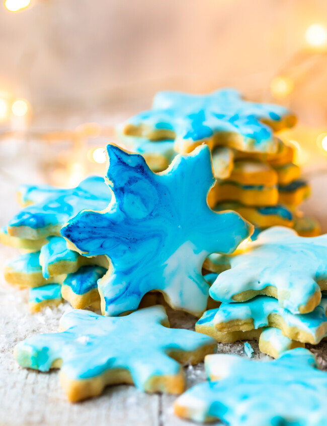 Christmas Butter Cookies with Powdered Sugar Icing are a MUST for the holidays. Simple iced cookies are one of the best treats for Christmas, and this easy butter cookies recipe is my FAVORITE. Make your favorite shapes with cookie cutters, and decorate however you like using our powdered sugar icing recipe!