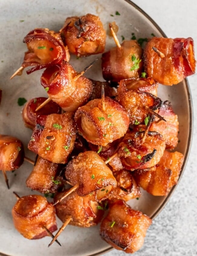 Bacon Wrapped Water Chestnuts are a simple and delicious appetizer for game day or any party. The soy-soaked water chestnuts are crunchy and flavorful, and once you add the bacon...yum! You can't go wrong with bacon wrapped appetizers. Try this bacon wrapped water chestnuts recipe right away!