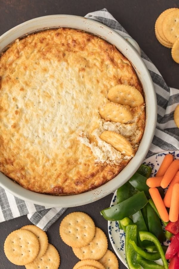 HOT ONION DIP has been a family favorite for years. I just love the sweet, cheesy onion flavor. You really can't do better than a classic hot onion dip recipe for the holidays or game day. It's perfect for dipping and oh so yummy. This is the BEST hot onion souffle dip recipe around!