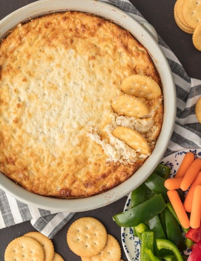 HOT ONION DIP has been a family favorite for years. I just love the sweet, cheesy onion flavor. You really can't do better than a classic hot onion dip recipe for the holidays or game day. It's perfect for dipping and oh so yummy. This is the BEST hot onion souffle dip recipe around!