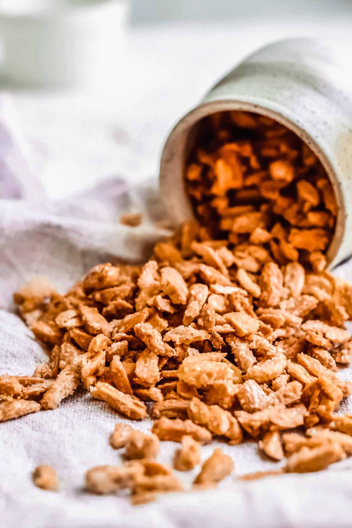 almonds spilling out of a ceramic container