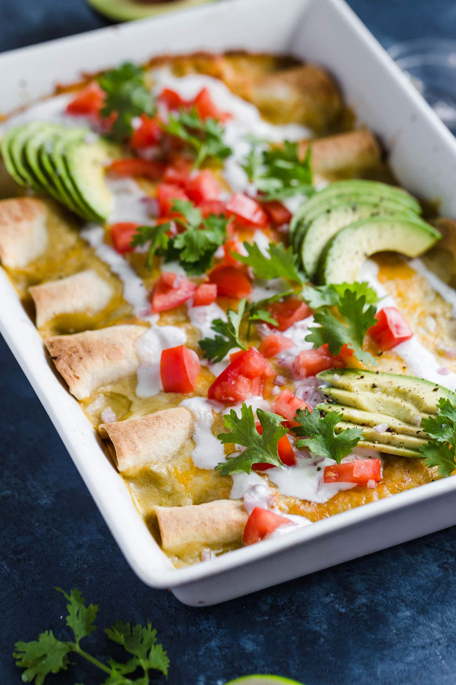 Easy enchilada recipe with chicken, mole sauce, sour cream, and more