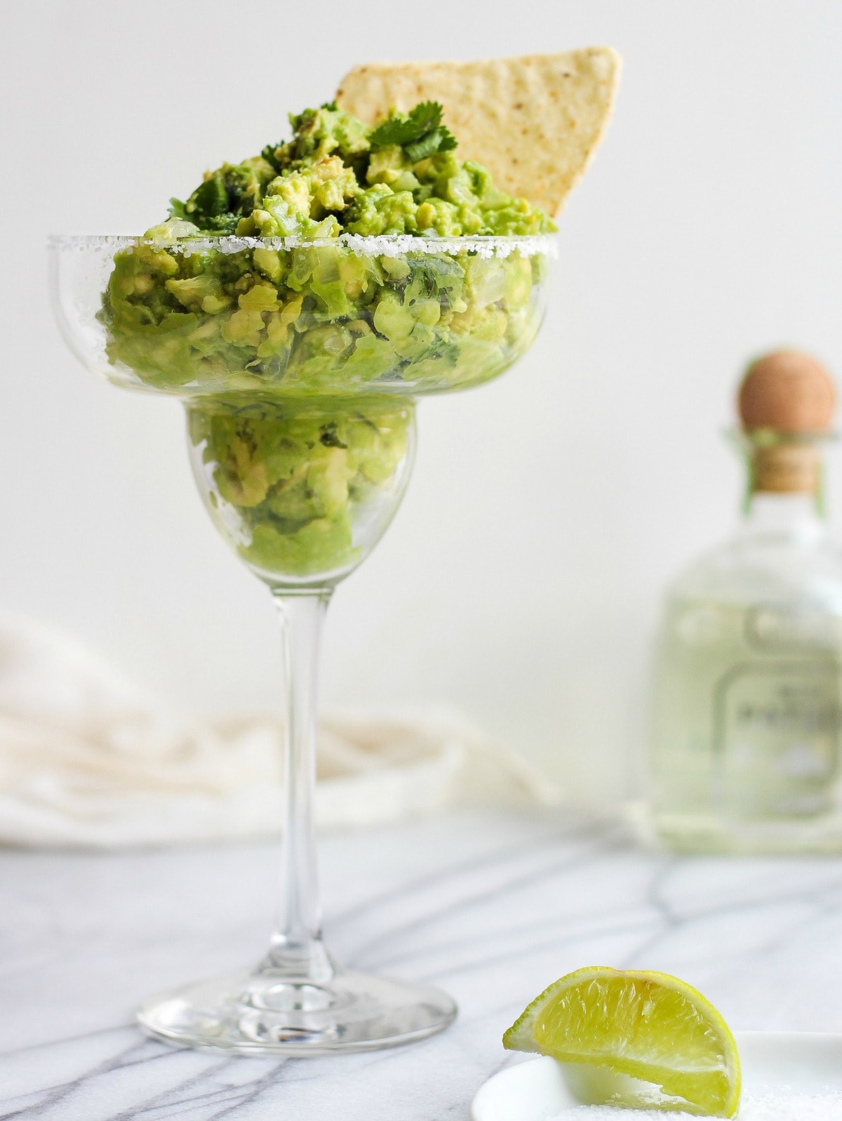 chunky guacamole recipe in a margarita glass