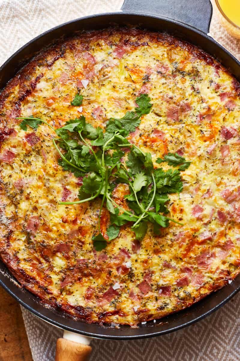 up close apple ham and cheese frittata in a skillet