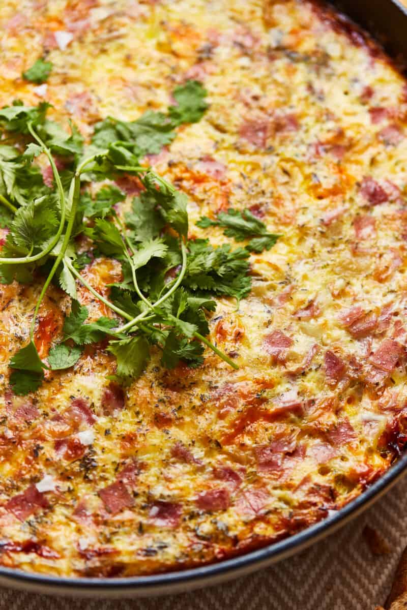 herbs on apple ham and cheese frittata
