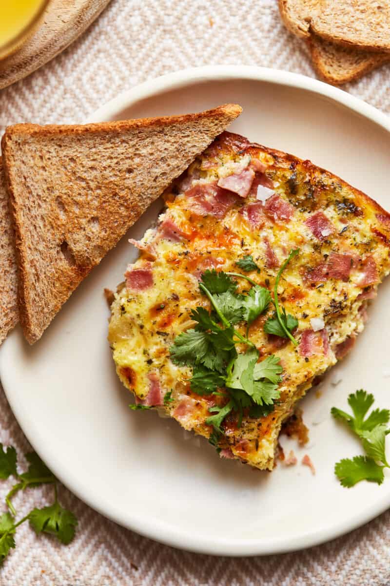 slice of apple ham and cheese frittata with toast