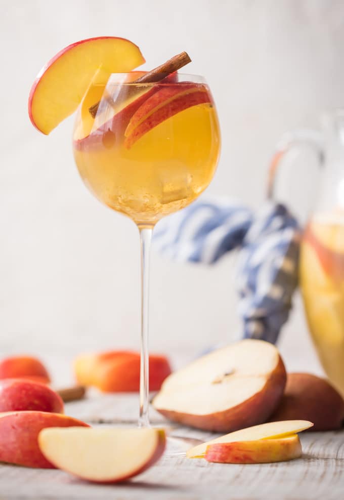 Apple Pie Sangria is light, refreshing, easy, and delicious! The hit of every party I take it to! Apple Cider, Caramel Vodka, White Wine, Ginger Ale, and more! The Cookie Rookie has Sangrias for every occasion!