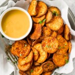 Sweet potato chips are a great healthy side dish that can go with just about anything! They are so easy and so much better than store-bought (deep fried) chips. This Baked Sweet Potato Chips Recipe is a go to for a fun and delicious but HEALTHY side dish. These Sweet Potato Chips are coated with a delicious spice blend and then baked and not fried. If you've wondered how to make Sweet Potato Chips crispy and addicting, today is your day!