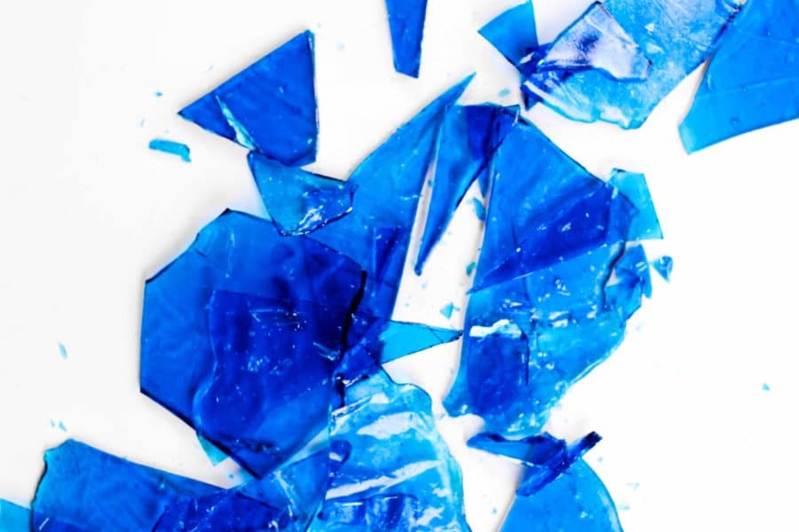 Overhead view of shards of blue colored sugar glass.