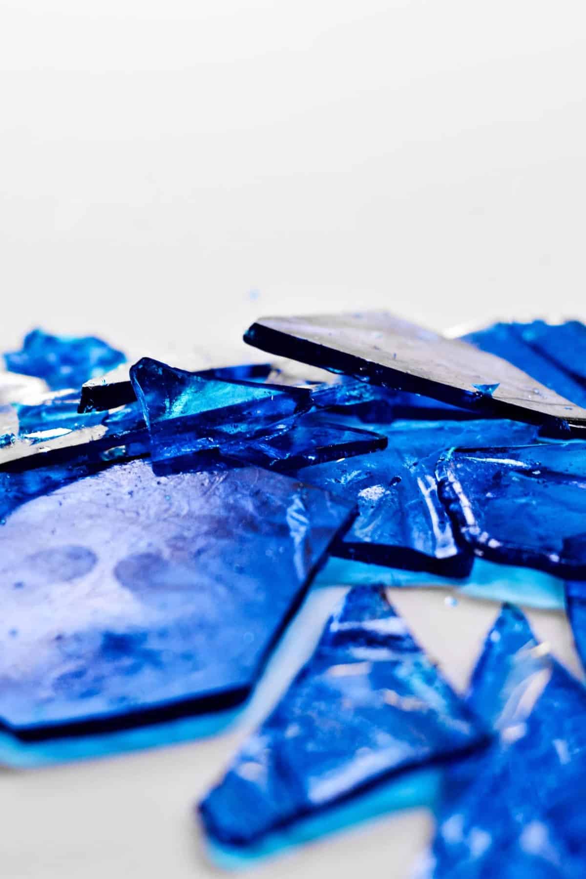 Broken pieces of blue sugar candy.