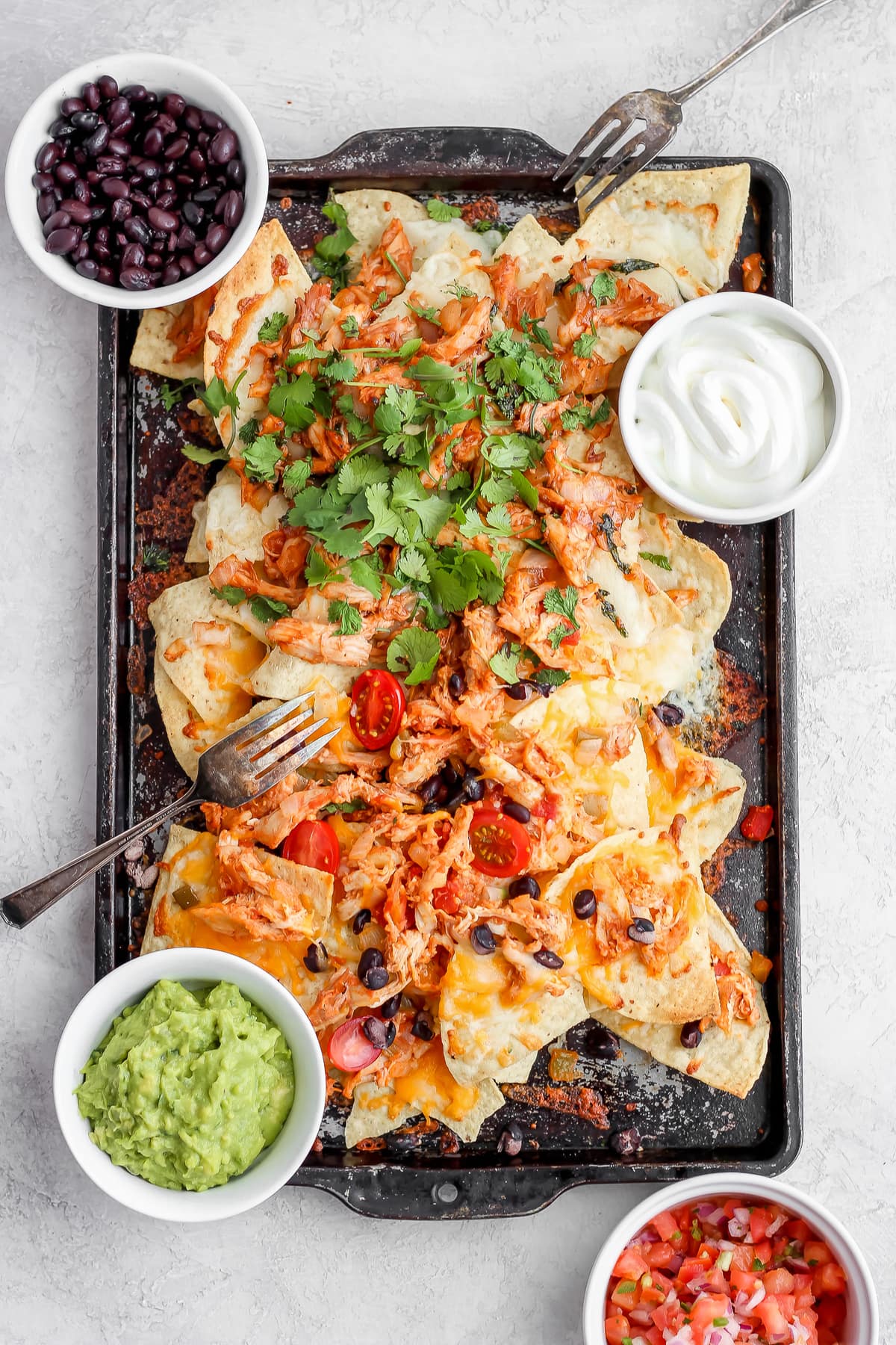 sheet pan with two flavors of grilled nachos