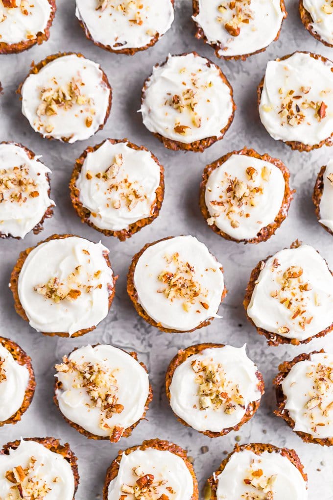 A batch of mini muffins with cream cheese frosting