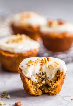 Pecan Pie Muffins are sure to brighten your morning! These tasty mini muffins are the perfect thing to eat for a quick breakfast, for a snack, or even as a fun dessert. They're so flavorful and taste just like pecan pie in muffin form. These breakfast muffins are so easy to make and taste even better with the cream cheese frosting!