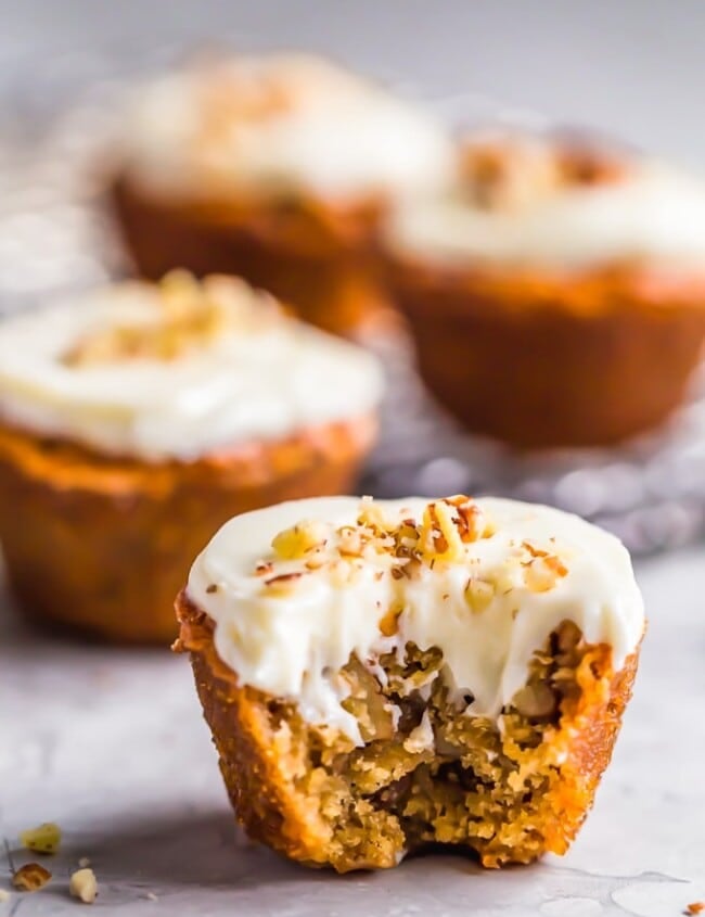 Pecan Pie Muffins are sure to brighten your morning! These tasty mini muffins are the perfect thing to eat for a quick breakfast, for a snack, or even as a fun dessert. They're so flavorful and taste just like pecan pie in muffin form. These breakfast muffins are so easy to make and taste even better with the cream cheese frosting!