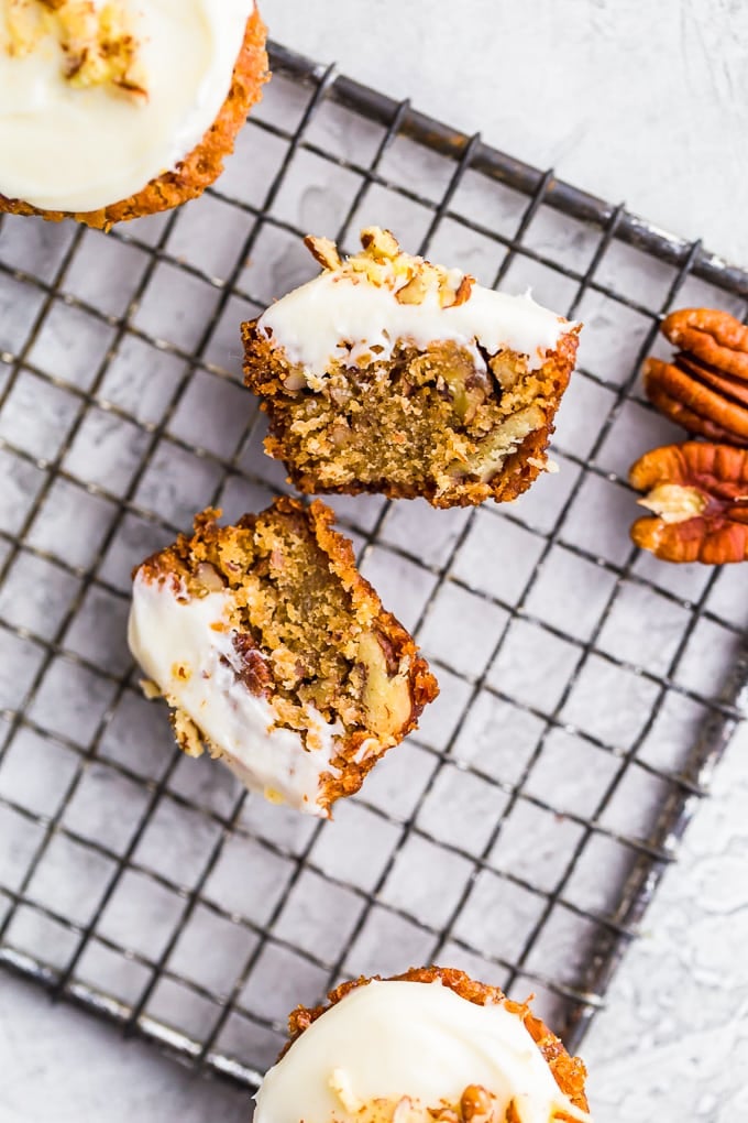 A mini muffin cut in half, sitting on a cooling rack