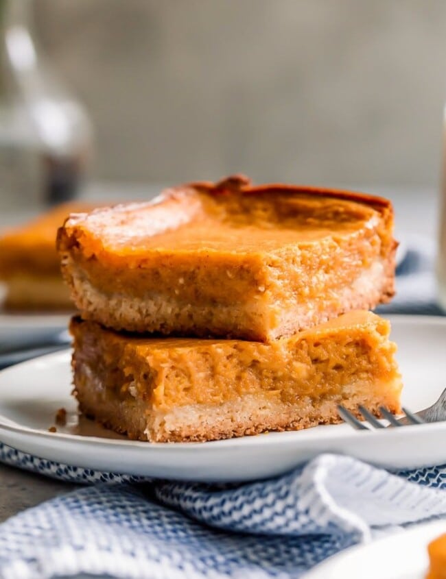 Pumpkin Gooey Butter Cake is a fall dessert recipe, but I like to make (and eat!) this ooey gooey cake year-round! If you don't know what gooey butter cake is, then you NEED to make this recipe ASAP. The combination of pumpkin and the gooey butter cake will blow your mind!