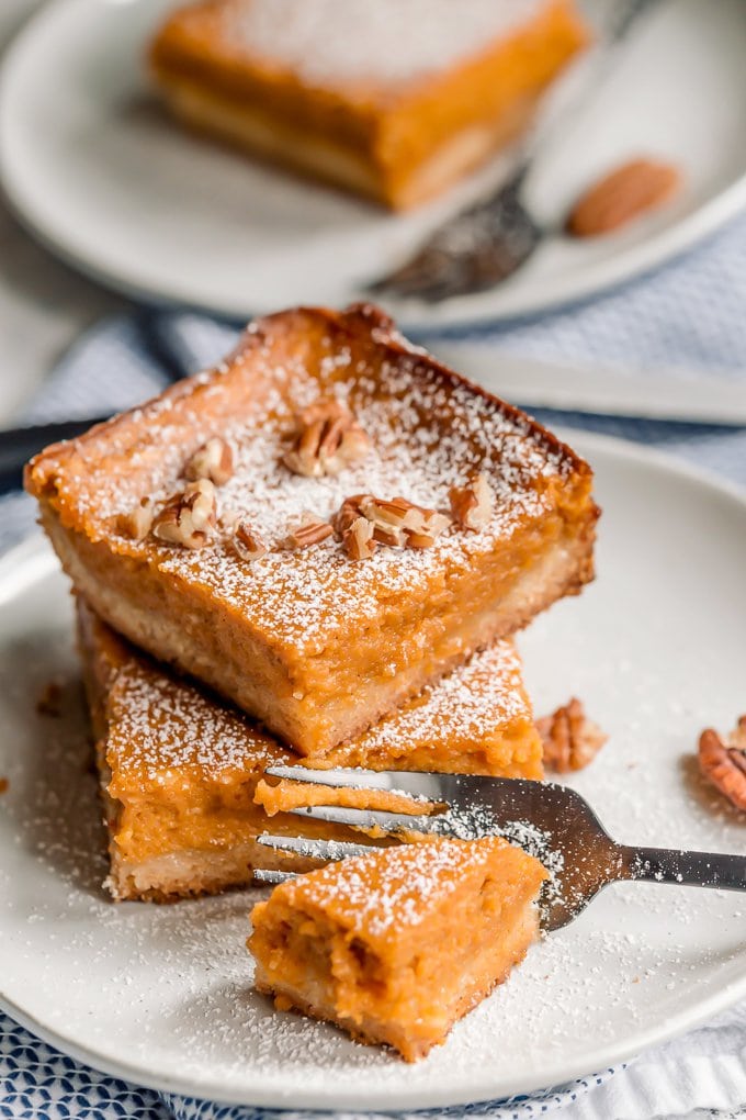 Two slices of gooey butter cake on a white plate