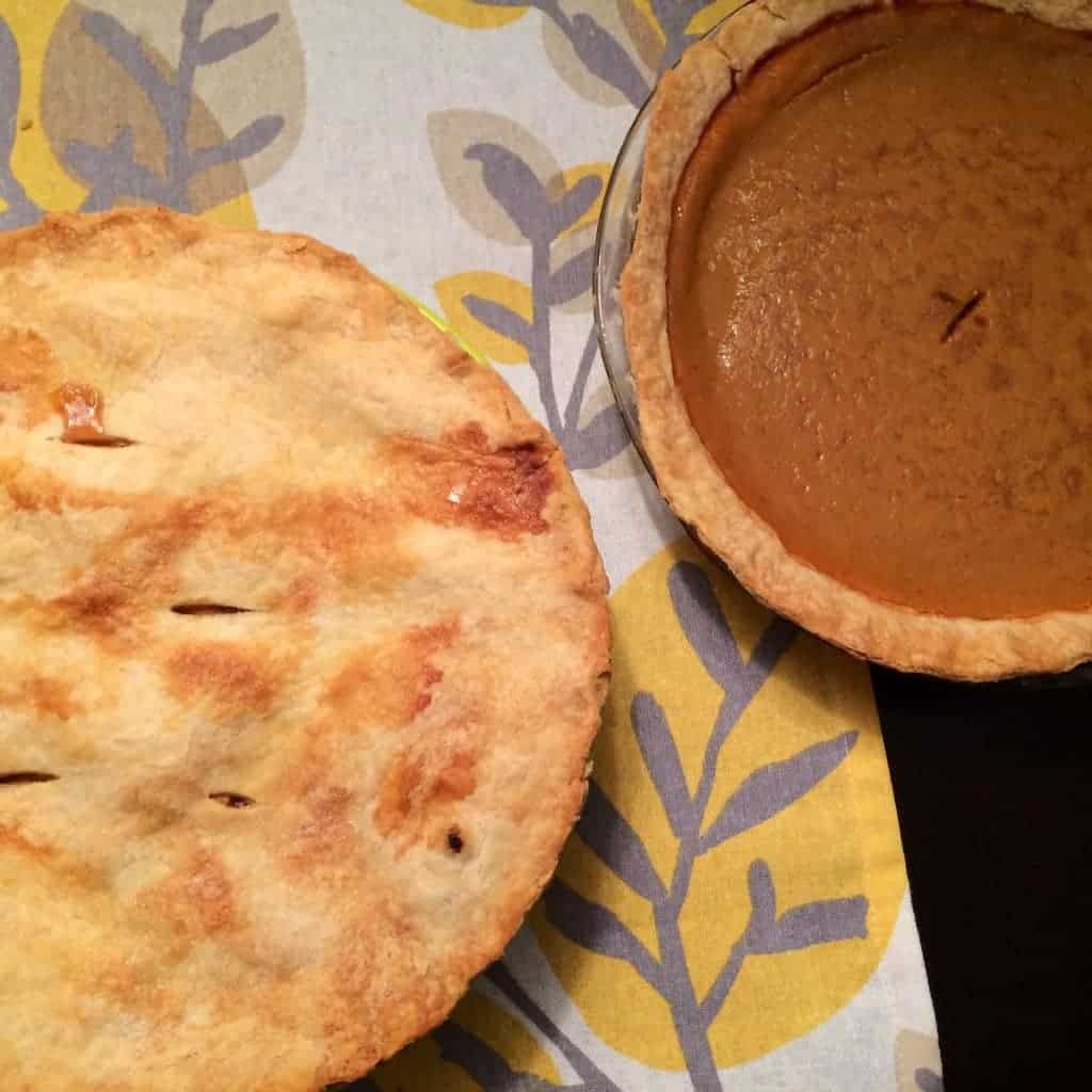 Apple pie and pumpkin pie on a table, showing the Homemade Pie Crusts.