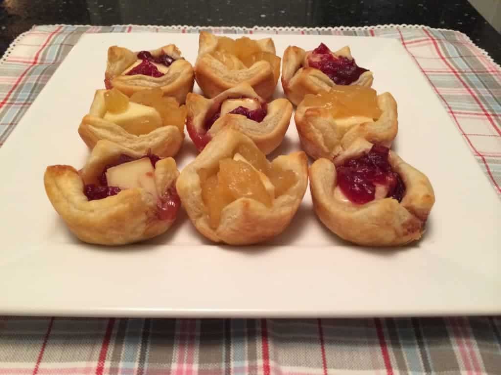 A tray of Apple and Cranberry Brie Bits sitting on a table.