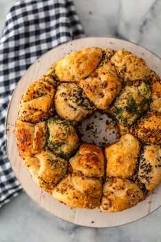 This Savory Monkey Bread recipe is flaky, flavorful and fun to eat. For an appetizer or a meal, it's a real crowd pleaser!