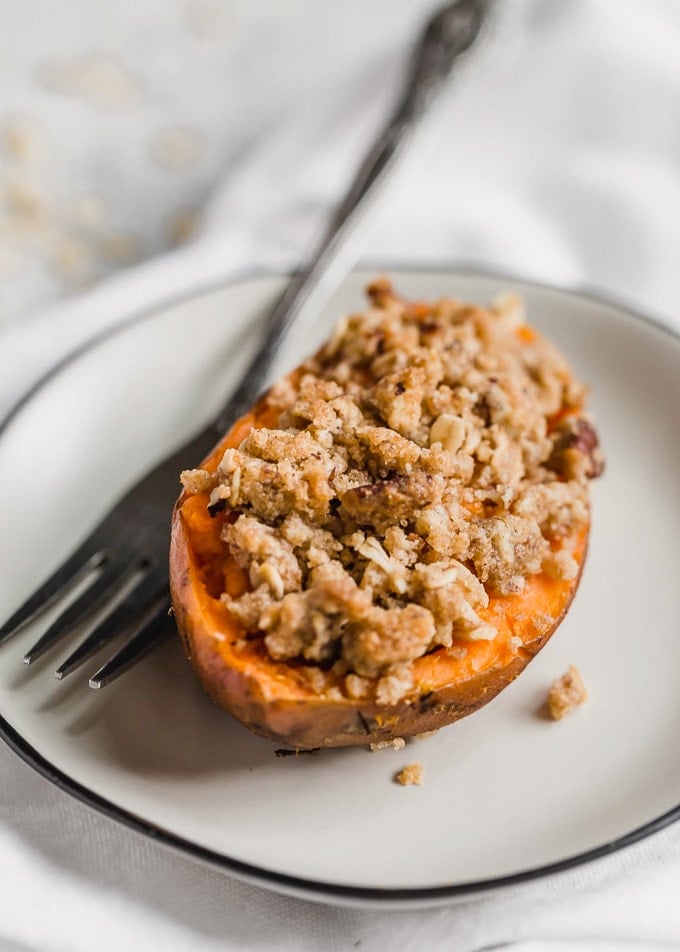 Half of a twice baked sweet potato on a white plate