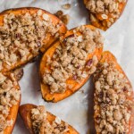 Twice Baked Sweet Potatoes are the perfect Thanksgiving sweet potato recipe! They're just like a regular twice baked potato, but they're topped with a pecan, cinnamon, oatmeal, and brown sugar mix to complement the natural sweetness. You'll definitely want this tasty sweet potato side dish on your holiday table!