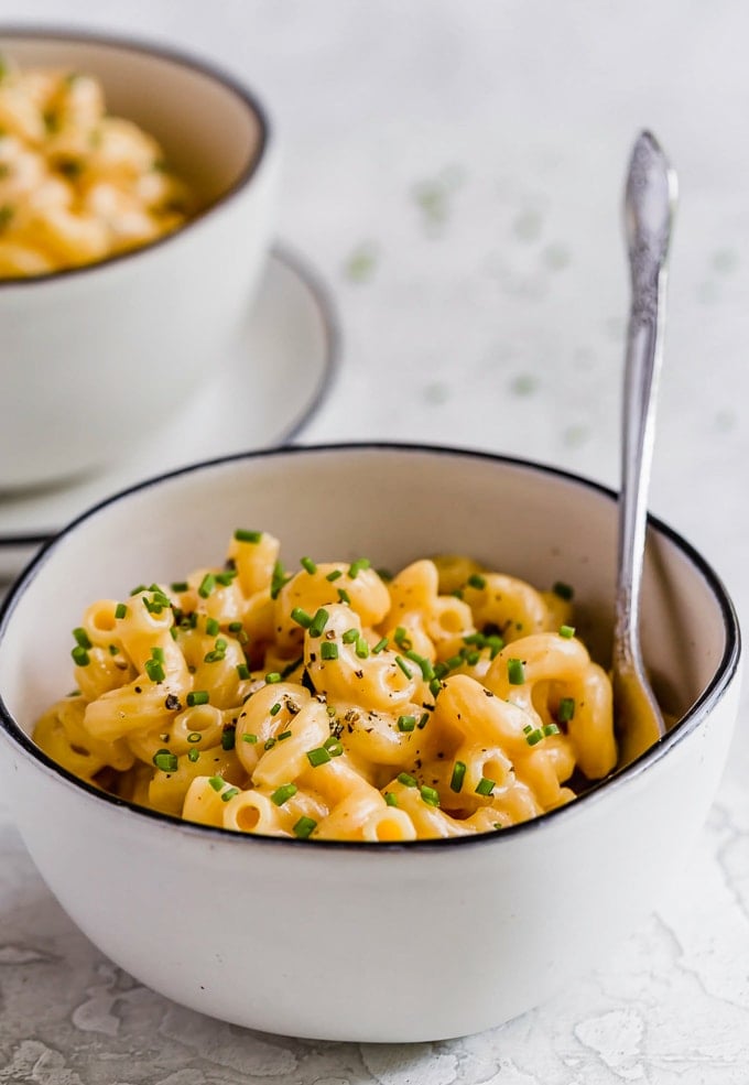 Simple mac and cheese recipe in two white bowls