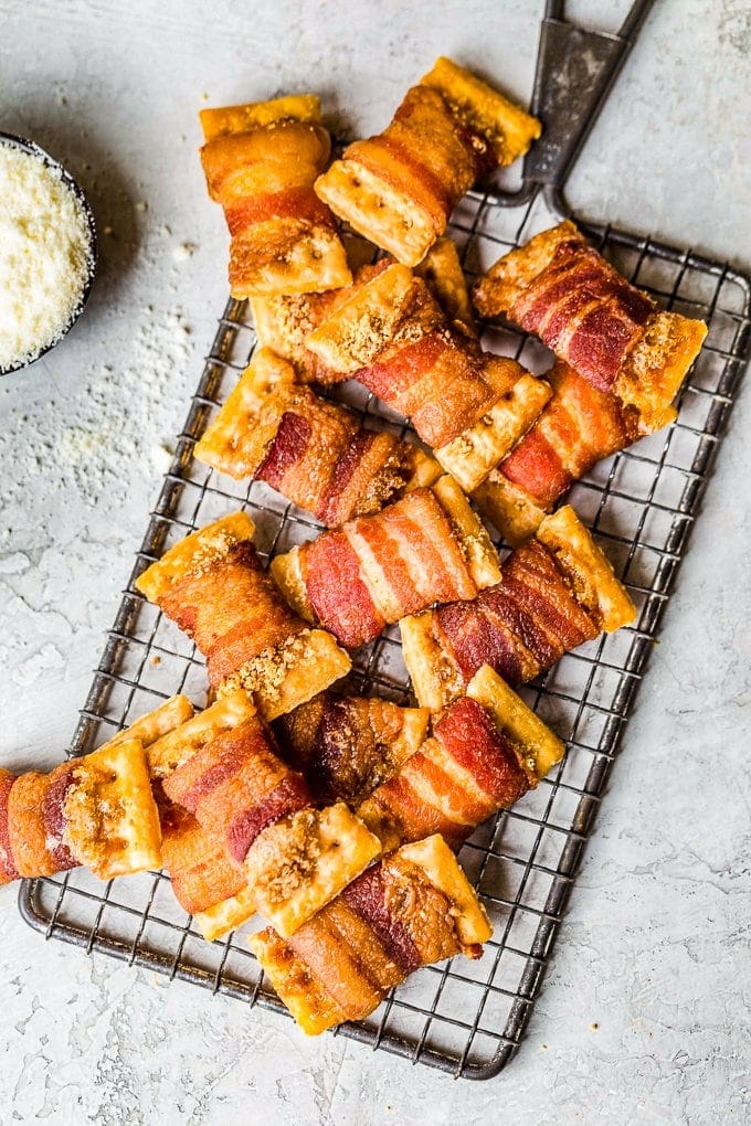 bacon wrapped crackers on a cooling rack
