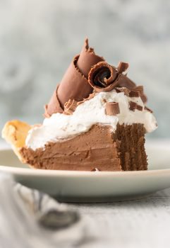 French Silk Pie is my all-time favorite pie recipe. This Chocolate Silk Pie is an easy version of a classic holiday favorite. We love this French Silk Pie at Thanksgiving, Christmas, Easter, my birthday, and every day in between. It tastes like chocolate mousse in pie form. Utterly decadent and delicious! Best French Silk Pie Recipe EVER!